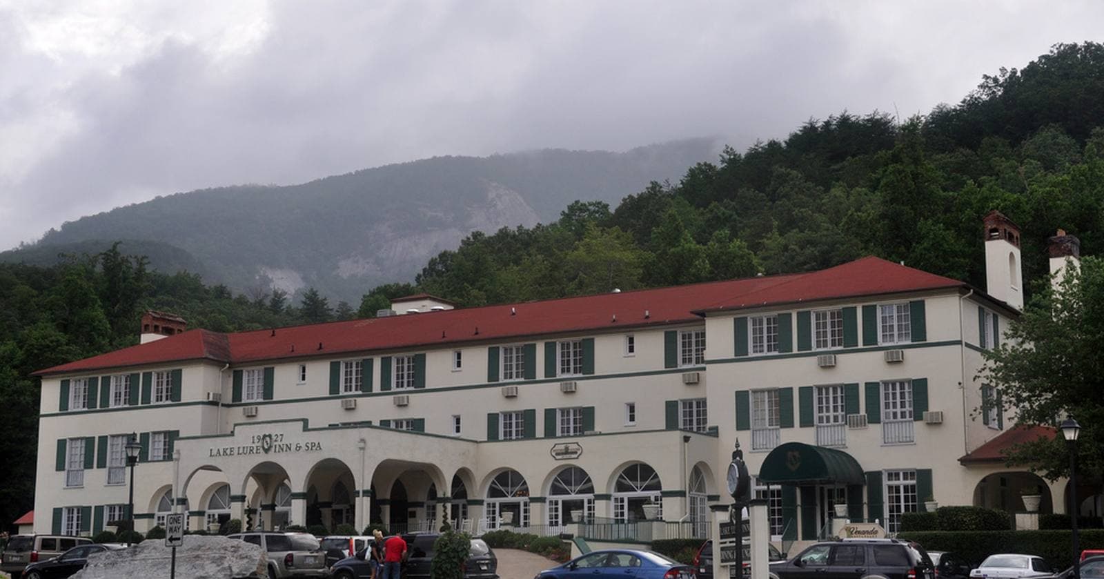 The historic Lake Lure Inn & Spa with mountains behind